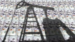 Pump jack on US US dollar notes